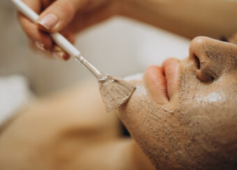 Woman visiting cosmetologist and making rejuvenation procedures