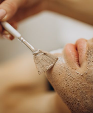 Woman visiting cosmetologist and making rejuvenation procedures